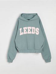 Bluza hoodie oversize z napisem - turkusowy. Niebieskie bluzy damskie Sinsay, l, bez wzorów, bez kaptura. Za 49.99 zł.