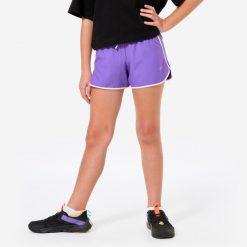 Spodenki sportowe dla dziewczynek. Białe spodenki dla dziewczynek DOMYOS, bez wzorów, z materiału, sportowe. Za 24.99 zł.