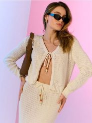 Ażurowy kardigan z wiązaniem - kremowy. Białe kardigany damskie Sinsay, l, w ażurowe wzory. Za 49.99 zł.