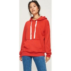 Bluza z kapturem - Pomarańczo. Różowe bluzy damskie Sinsay. Za 49.99 zł.