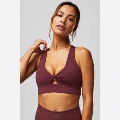 Biustonosz dla kobiet Fabletics Oasis Twist. Czerwone biustonosze FABLETICS, bez wzorów, z elastanu. Za 256.60 zł.