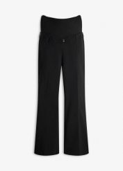 Wygodne spodnie ciążowe ze stretchem o kroju bootcut. Czarne spodnie materiałowe damskie bonprix, bez wzorów. Za 179.99 zł.