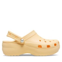 Klapki Crocs. Żółte klapki damskie Crocs, bez wzorów, bez obcasa. Za 189.99 zł.
