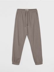 Dresowe spodnie jogger terry - brązowy. Brązowe spodnie dresowe damskie Sinsay, l, bez wzorów, z dresówki. Za 29.99 zł.