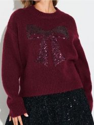 Sweter z cekinową aplikacją w kształcie kokardy i domieszką wełny - różowy. Czerwone swetry damskie Sinsay, l, z aplikacjami, z wełny, bez kołnierzyka, bez ramiączek, bez kaptura. Za 69.99 zł.