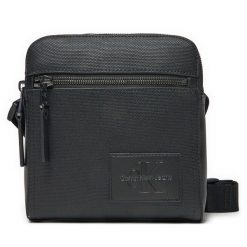 Saszetka Calvin Klein Jeans. Czarne saszetki męskie Calvin Klein Jeans, z jeansu, młodzieżowe, małe. Za 209.99 zł.