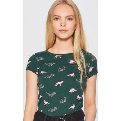 Koszulka z nadrukiem w dinozaury - Khaki. T-shirty damskie marki DOMYOS. Za 24.99 zł.