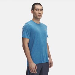 Koszulka do biegania męska Under Armour Launch Camo. Niebieskie koszulki sportowe męskie Under Armour, m, bez wzorów, bez kołnierzyka, bez ramiączek, do biegania. Za 168.65 zł.