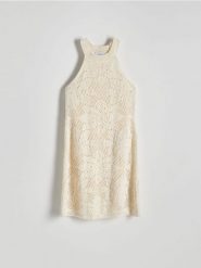 Ażurowa sukienka - kremowy. Białe sukienki damskie Reserved, l, w ażurowe wzory, z bawełny, bez kołnierzyka, bez ramiączek, mini. W wyprzedaży za 89.99 zł.
