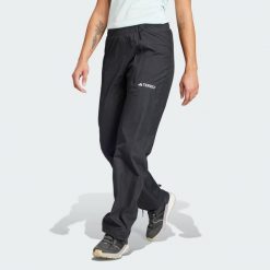 Spodnie Terrex Multi RAIN.RDY 2-Layer Rain. Czarne obuwie sportowe damskie Adidas, bez wzorów, z materiału. W wyprzedaży za 299.40 zł.