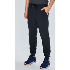 Under Armour - Spodnie Rival Cotton Jogger. Szare spodnie sportowe męskie Under Armour, z bawełny. W wyprzedaży za 219.90 zł.