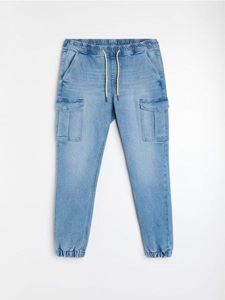 Jeansy jogger cargo z efektem sprania - niebieski. Niebieskie jeansy męskie Sinsay. Za 69.99 zł.