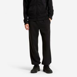 Spodnie dresowe męskie Domyos. Czarne spodnie sportowe męskie DOMYOS, l, bez wzorów, z dresówki, na fitness i siłownię. Za 44.99 zł.