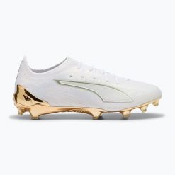 Buty piłkarskie PUMA Ultra 6 Ultimate FG puma white/metallic gold/puma black. Białe obuwie sportowe damskie Puma, bez wzorów, z materiału, do biegania. Za 689.99 zł.
