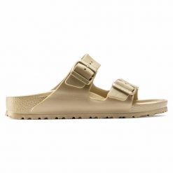 Klapki Birkenstock Arizona 1022465 złoty. Żółte klapki damskie bez wzorów, z materiału, klasyczne, bez obcasa. Za 361.45 zł.