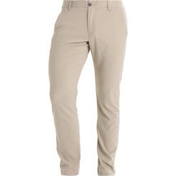 Under Armour TAKEOVER GOLF PANT TAPER Spodnie materiałowe city khaki. Spodnie sportowe męskie marki Under Armour. Za 359.00 zł.