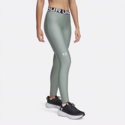 Legginsy treningowe damskie Under Armour HeatGear. Zielone legginsy damskie Under Armour, m, bez wzorów, na fitness i siłownię. Za 139.99 zł.