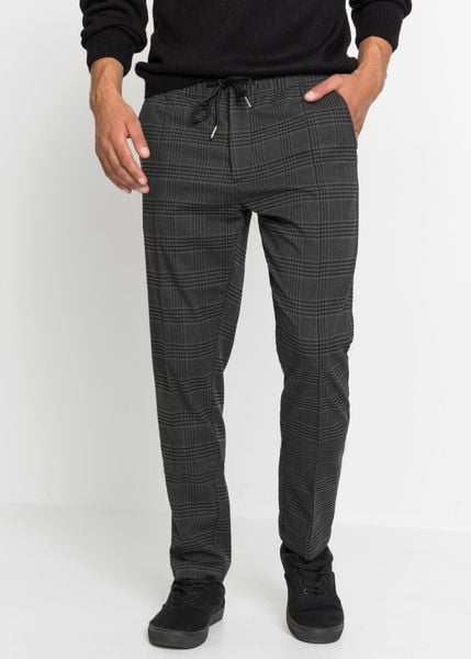 Spodnie z wygodnym pasem w talii, regular fit, z materiału o wyglądzie wełny. Szare eleganckie spodnie męskie bonprix, m, bez wzorów, z wełny. Za 159.99 zł.