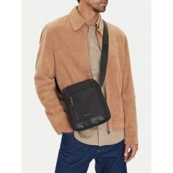 Saszetka GINO ROSSI. Czarne saszetki męskie Gino Rossi, młodzieżowe, małe. Za 99.99 zł.