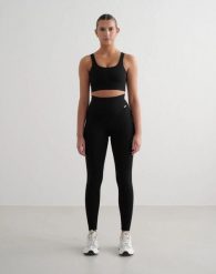 Damskie legginsy prążkowane bezszwowe, wydłużone, wysoki stan, czarne. Czarne legginsy damskie Aim'n, xs, bez wzorów, z elastanu. Za 260.00 zł.