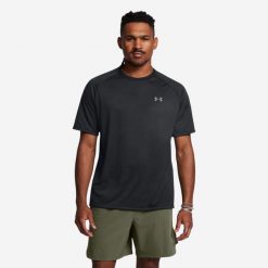 Koszulka fitness męska Under Armour UA Tech™ 2.0. Czarne koszulki sportowe męskie Under Armour, l, bez wzorów, z materiału, bez kołnierzyka, bez ramiączek, na fitness i siłownię. Za 79.99 zł.