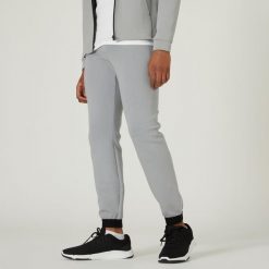 Spodnie dresowe męskie Nyamba Gym & Pilates 540 slim. Szare spodnie sportowe męskie DOMYOS, l, bez wzorów, z bawełny, na fitness i siłownię. Za 89.99 zł.