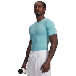 Koszulka Under Armour HeatGear. Niebieskie koszulki sportowe męskie Under Armour, l, bez wzorów, z materiału, bez kołnierzyka, bez ramiączek, na fitness i siłownię. Za 197.00 zł.