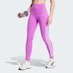 Legginsy Optime 3-Stripes Full-Length. Fioletowe legginsy damskie Adidas, xl, bez wzorów, z materiału. W wyprzedaży za 204.55 zł.