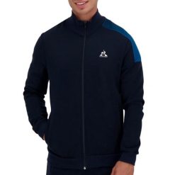Bluza zapinana na zamek błyskawiczny Le Coq Sportif Heritage SP N°1. Niebieskie bluzy męskie le coq sportif, s, z aplikacjami, z bawełny, z kapturem, na fitness i siłownię. Za 370.80 zł.