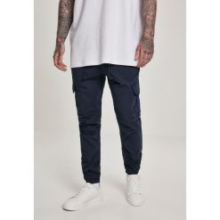 Spodnie Urban Classic Cargo Jogging. Niebieskie spodnie sportowe męskie Urban Classics, xs, bez wzorów, z bawełny, do biegania. Za 200.00 zł.