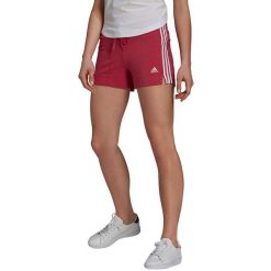 Spodenki krótkie damskie adidas Essentials Slim Short. Czerwone szorty damskie Adidas, bez wzorów, z bawełny, klasyczne, z standardowym stanem. Za 94.99 zł.