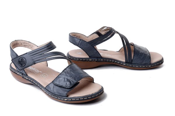 Rieker 65964-12 niebieski, sandały damskie. Niebieskie sandały damskie Rieker, bez wzorów, ze skóry, bez obcasa, bez zapięcia. Za 319.90 zł.