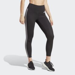 Legginsy treningowe z wysokim stanem Train Essentials 3-Stripes 7/8. Czarne legginsy damskie Adidas, s, bez wzorów, z materiału, z podwyższonym stanem, na fitness i siłownię. Za 229.00 zł.