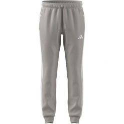 Spodnie męskie adidas Tricot Regular Tapered. Brązowe spodnie sportowe męskie Adidas, m, bez wzorów, z poliesteru, na fitness i siłownię. Za 153.99 zł.