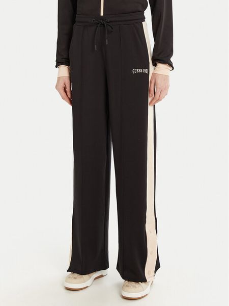 Guess Spodnie dresowe V5RB00 KCO72 Brązowy Regular Fit. Brązowe spodnie dresowe damskie Guess, s, z aplikacjami, z dresówki. Za 219.99 zł.