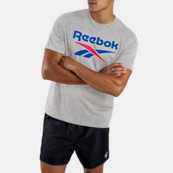 Koszulka fitness męska Reebok. Koszulki sportowe męskie Reebok, m, bez wzorów, z bawełny, bez kołnierzyka, bez ramiączek, na fitness i siłownię. Za 99.99 zł.