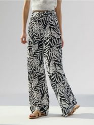 Spodnie wide leg w roślinny wzór - wielobarwny. Spodnie materiałowe damskie Sinsay, l, bez wzorów. Za 49.99 zł.