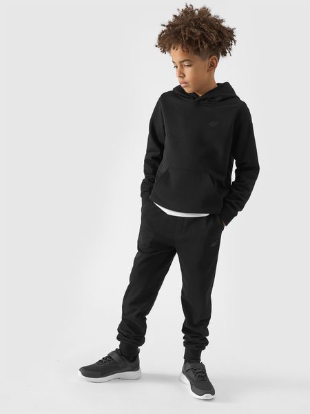 4F Spodnie dresowe joggery chłopięce - czarne 146 (10-11 lat). Czarne spodnie sportowe dla chłopców 4f, bez wzorów, z bawełny, sportowe. Za 69.99 zł.