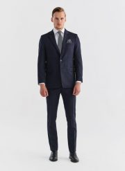 PAKO LORENTE – Wełniane spodnie garniturowe w kratę. Niebieskie eleganckie spodnie męskie Pako Lorente, bez wzorów, z wełny. Za 999.99 zł.