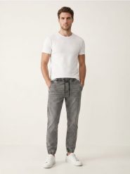 Jeansy jogger slim z efektem sprania - szary. Szare jeansy męskie Sinsay. Za 59.99 zł.