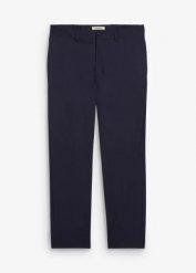 Spodnie garniturowe o kroju relaxed fit. Niebieskie eleganckie spodnie męskie bonprix, m, bez wzorów. Za 169.99 zł.