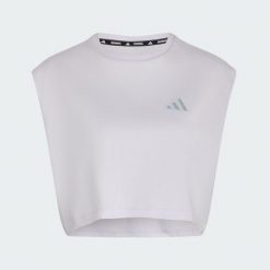 Koszulka adi365 Running Essentials Crop. Fioletowe koszulki sportowe damskie Adidas, l, bez wzorów, z bawełny, klasyczne, bez kołnierzyka. Za 99.95 zł.