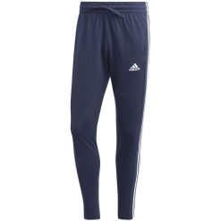 Spodnie męskie adidas Essentials Single Jersey Tapered Open Hem 3-Stripes. Czarne spodnie materiałowe męskie Adidas, m, bez wzorów, z jersey. Za 159.00 zł.
