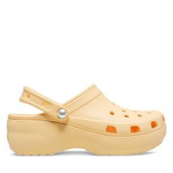 Klapki Crocs. Żółte klapki damskie Crocs, bez wzorów, bez obcasa. Za 399.99 zł.