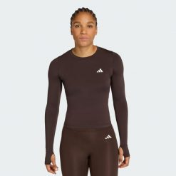 Koszulka Power Essentials Workout Contour Long Sleeve. Brązowe koszulki sportowe damskie Adidas, bez wzorów, sportowe, bez kołnierzyka. Za 149.00 zł.