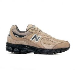 Buty do chodzenia damskie New Balance 2002. Brązowe obuwie sportowe damskie New Balance, bez wzorów, z materiału, trekkingowe. Za 479.00 zł.