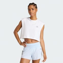 Koszulka adi365 Running Essentials Crop. Białe koszulki sportowe damskie Adidas, bez wzorów, bez kołnierzyka, bez ramiączek, do biegania. Za 99.95 zł.