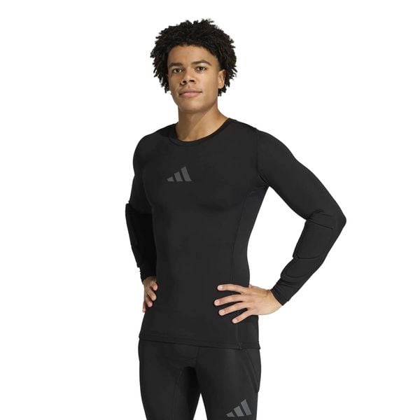 Adidas Sport T-Shirt Gk Pad Ls M Dorośli. Czarne bluzki z długim rękawem męskie Adidas, m, bez wzorów, z dzianiny, klasyczne, bez kołnierzyka. Za 179.99 zł.