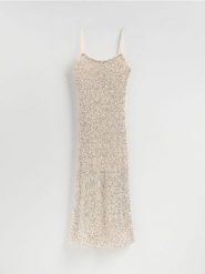 Sukienka z cekinami - srebrny. Szare sukienki damskie Reserved, l, bez wzorów, z dzianiny, bez kołnierzyka, bez ramiączek, dopasowane. Za 199.99 zł.