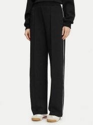 Guess Spodnie dresowe V6BB05 K6265 Czarny Regular Fit. Czarne spodnie dresowe damskie Guess, xxs, z aplikacjami, z dresówki. Za 394.99 zł.